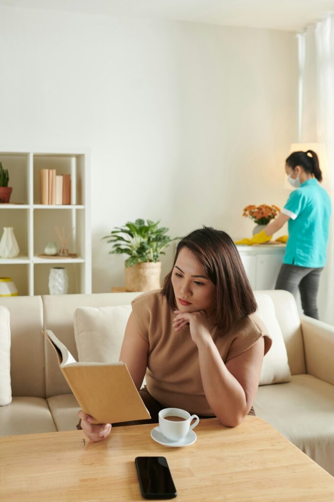 Woman delegating housework to cleaning service