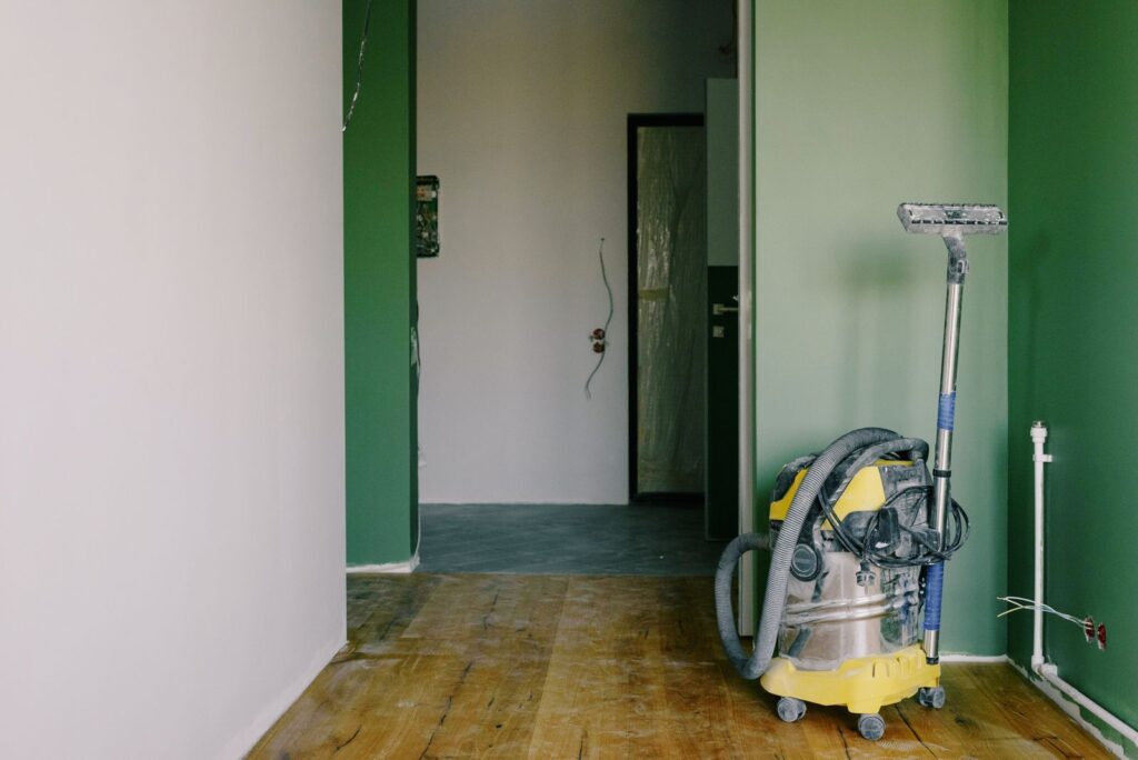 Post-construction cleaning in Indianapolis, IN — industrial vacuum cleaning a newly renovated room