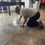 Taylor Cleaning LLC professional scrubbing a tile floor in Indianapolis